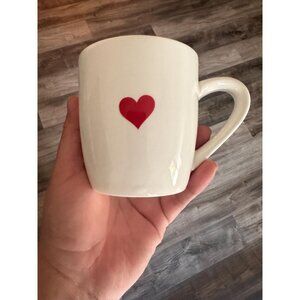 Small white cup mug with a cute red heart for Valentine's